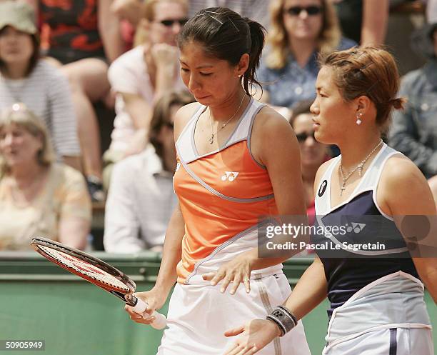 Rika Fujiwara of Japan in her second round doubles match with Shinobu Asagoe of Japan during Day Five of the 2004 French Open Tennis Championship at...