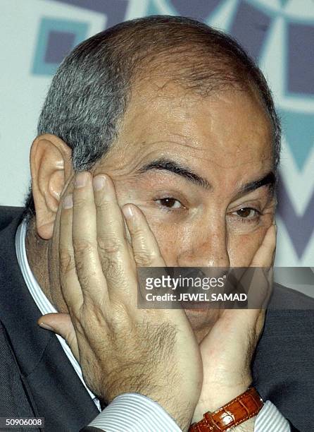 Photo dated 15 October 2003 of Iraqi Governing Council member Iyad Allawi at a press conference at the convention center in Malaysia's administrative...
