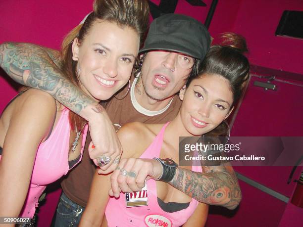 Tommy Lee poses with employees at the Grand Opening party for Rok Bar on May 27, 2004 in Miami Beach, Florida. Tommy Lee is part owner of the new...