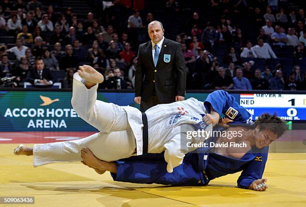 Roy Meyer of the Netherlands knocks double world silver medallist and twice Japanese national champion, Ryu Shichinohe to the mat eventually winning...