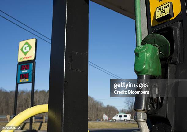 Diesel pump sits as fuel prices are displayed on a sign at a Go Mart Inc. Gas station in Rockbridge, Ohio, U.S., on Saturday, Feb. 6, 2016. Thanks to...