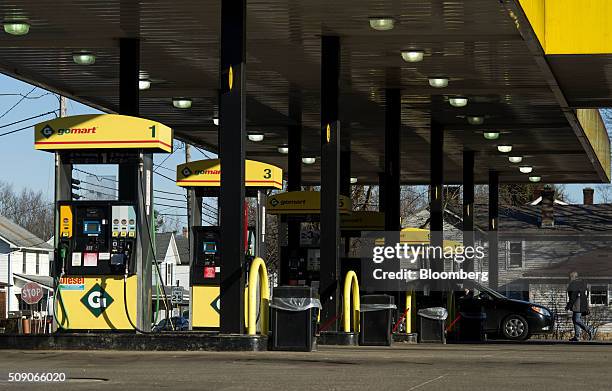 Customer walks back to a vehicle after paying for fuel at a Go Mart Inc. Gas station in Rockbridge, Ohio, U.S., on Saturday, Feb. 6, 2016. Thanks to...