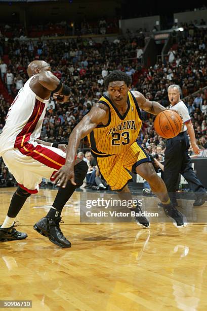 Ron Artest of the Indiana Pacers drives on Lamar Odom of the Miami Heat in Game six of the Eastern Conference Semifinals during the 2004 NBA Playoffs...