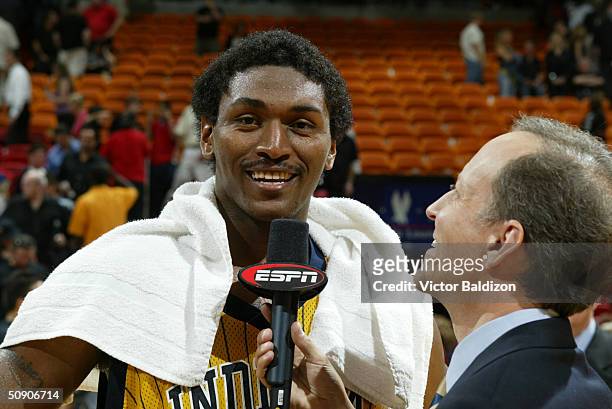 Ron Artest of the Indiana Pacers talks with ESPN reporter Jim Gray after Game six of the Eastern Conference Semifinals during the 2004 NBA Playoffs...