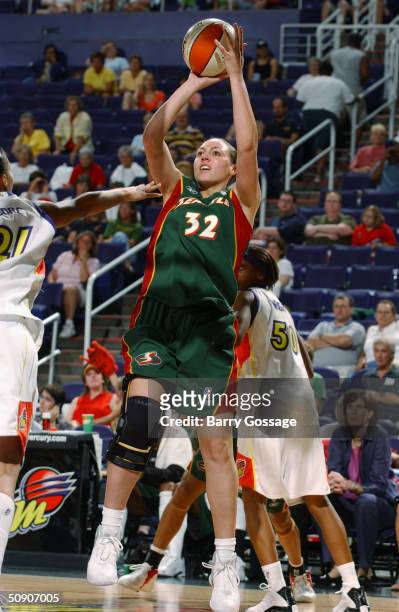 Adia Barnes of the Seattle Storm shoots against the Phoenix Mercury during a WNBA preseason game at America West Arena on May 5, 2004 in Phoenix,...