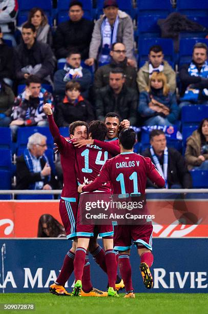 Mikel Oyarzabal of Real Sociedad de Futbol celebrates with his teammates Ruben Pardo , Jonathas Cristian de Jesus and Carlos Vela after scoring his...