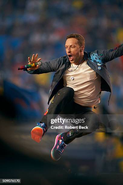 Super Bowl 50: Celebrity singer Chris Martin of Coldplay performing during halftime show of Denver Broncos vs Carolina Panthers game at Levi's...