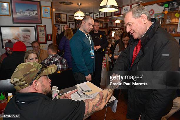 Former Virginia Governor and presidential candidate Jim Gilmore greets diners at SiriusXM Broadcasts' New Hampshire Primary Coverage Live From Iconic...