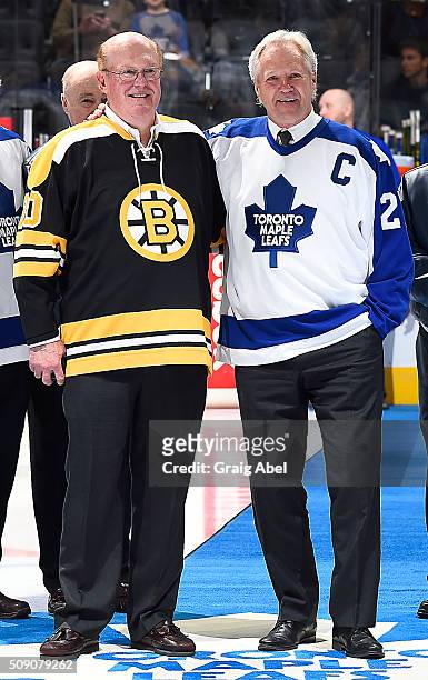 Former Boston Bruin goalie Dave Reece and former Toronto Maple Leaf Darryl Sittler pose for a photo during a pregame ceremony celebrating the 40th...