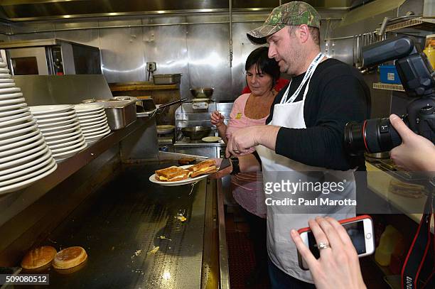 Wilkow Majority Host Andrew Wilkow takes a cooking lesson from Red Arrow Diner owner Carol Lawrence during SiriusXM Broadcasts' New Hampshire Primary...