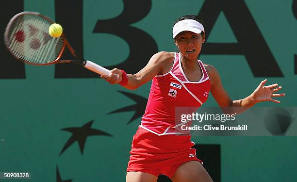 Shinobu Asagoe of Japan plays a return during her third round match against Gisela Dulko of Argentina during Day Six of the 2004 French Open Tennis...