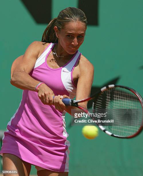 Gisela Dulko of Argentina plays a return during her third round match against Shinobu Asagoe of Japan during Day Six of the 2004 French Open Tennis...
