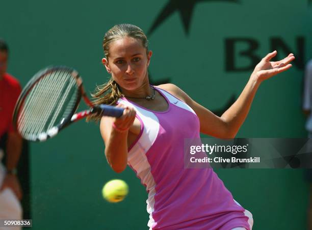 Gisela Dulko of Argentina plays a return during her third round match against Shinobu Asagoe of Japan during Day Six of the 2004 French Open Tennis...