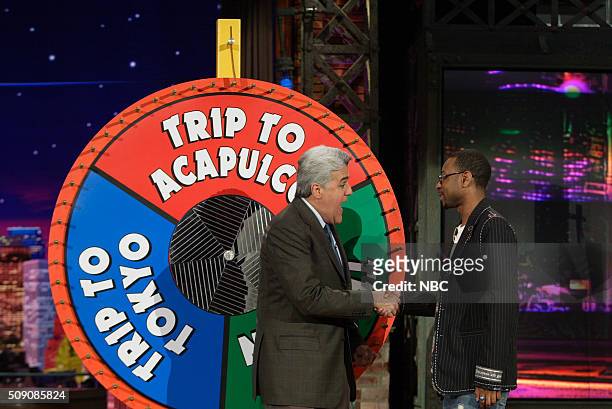 Episode 2908 -- Pictured: Host Jay Leno and singer Nikko Smith during the "American Idol Wheel of Consolation" on April 7, 2005 --