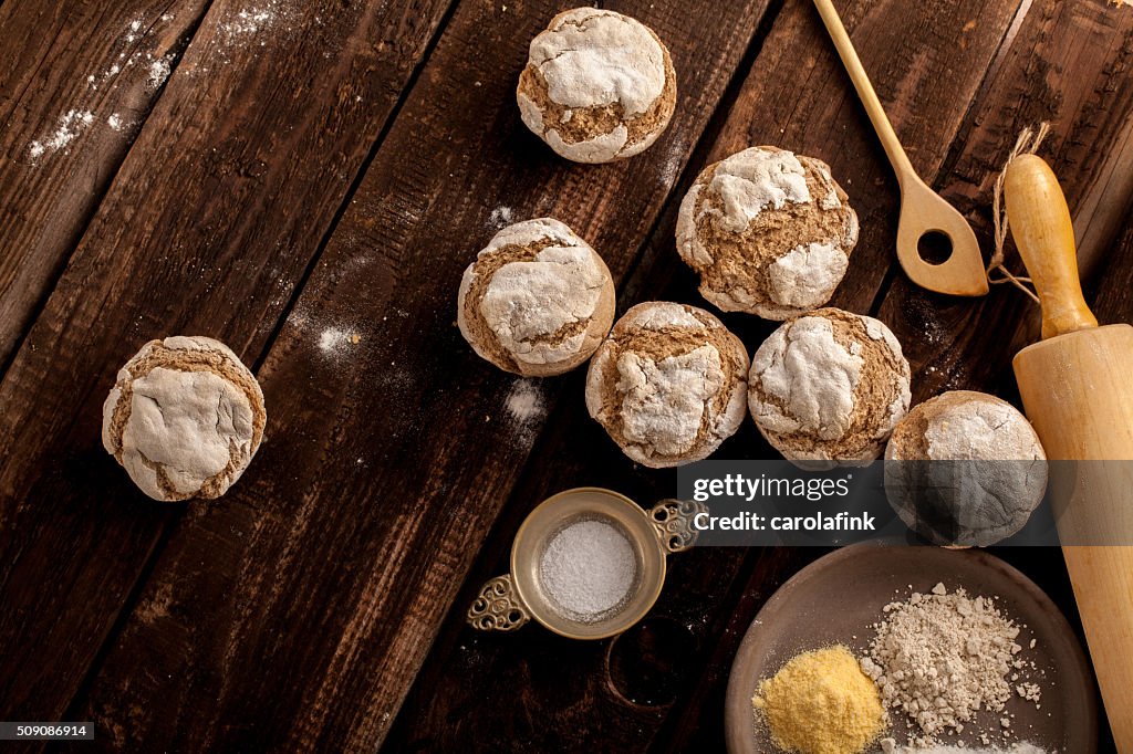 Fresh bread buns on wooden board