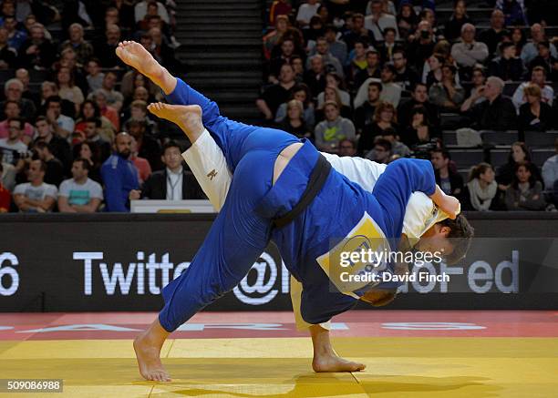 Ryu Shichinohe of Japan throws Daniel Natea of Romania for an ippon with uchi-mata on his way to the o100kg bronze medal contest that he lost during...