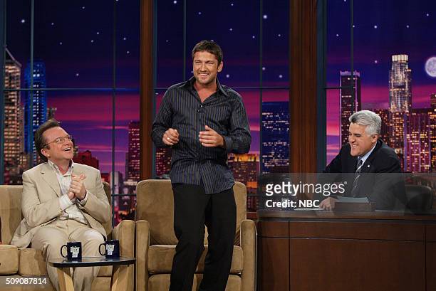 Episode 2913 -- Pictured: Actor Tom Arnold and actor Gerard Butler during an interview with host Jay Leno on April 14, 2005 --