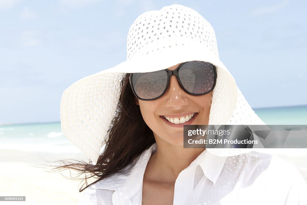 Portrait Of Happy Young Woman On Beach