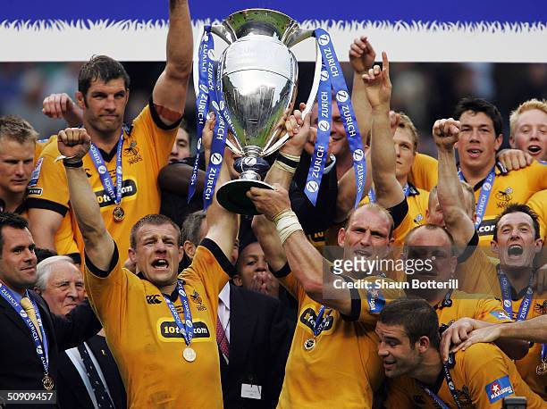 Lawrence Dallaglio and Paul Volley of Wasps lift the Zurich Premiership Cup after the Zurich Premiership Final match between Bath and London Wasps at...