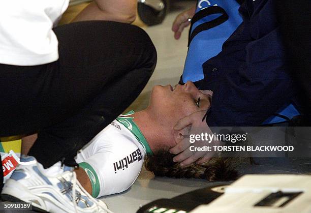 Australia's Rochelle Gilmore receives medical attention after colliding with Spain's Gema Pascual Torrecilla during the women's 10 km scratch final...