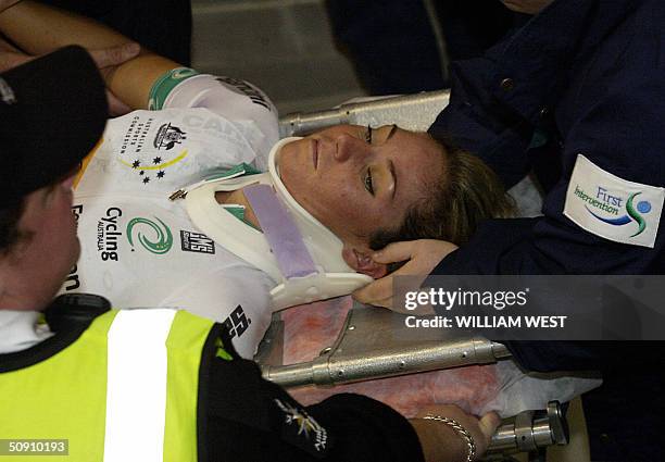 Australia's Rochelle Gilmore is carried off the track by stretcher after colliding with Spain's Gema Pascual Torrecilla during the women's 10 km...