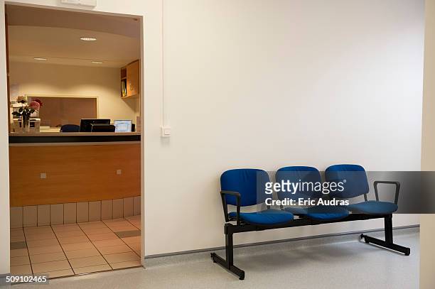 waiting bench outside of doctor's office in hospital - väntrum bildbanksfoton och bilder