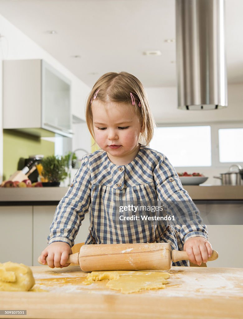 Toddler baking in kitchen