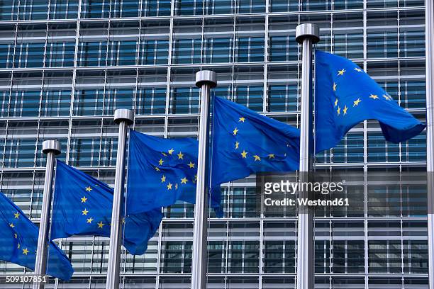 belgium, brussels, european commission, european flags at berlaymont building - berlaymont stock-fotos und bilder