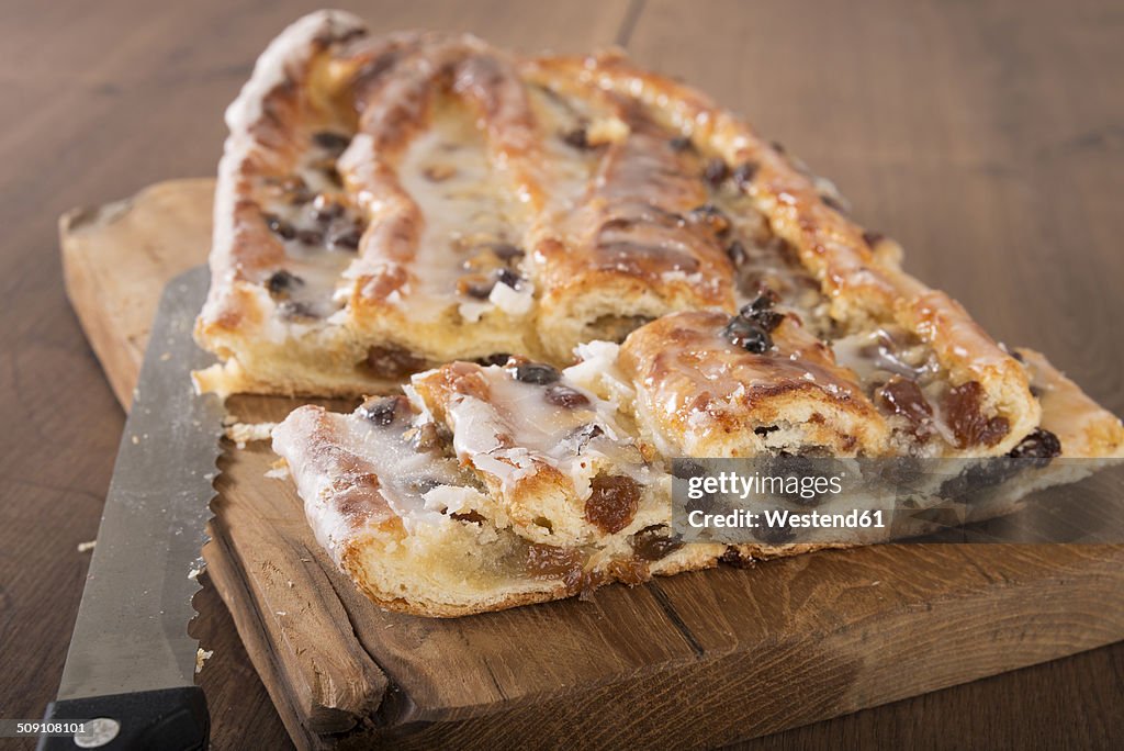 Sliced Danish pastry with marzipan on wooden board