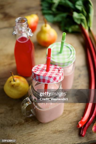 fresh pear and rhubarb smoothie - yoghurt lid stock pictures, royalty-free photos & images