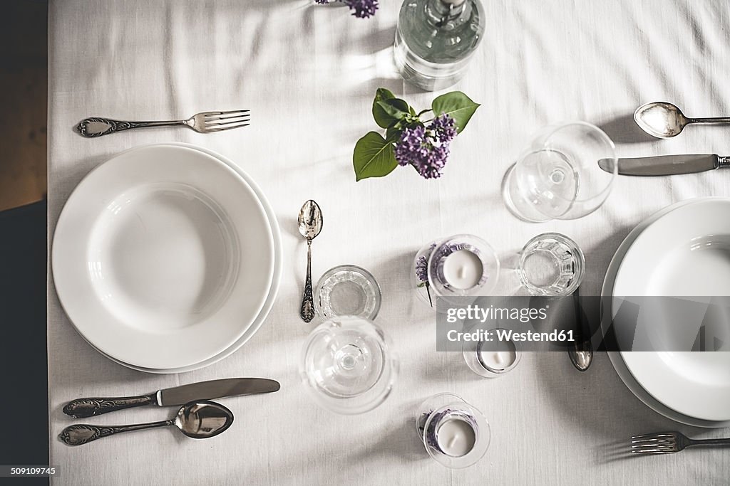 Festive laid table with lilac, Syringa, view from above