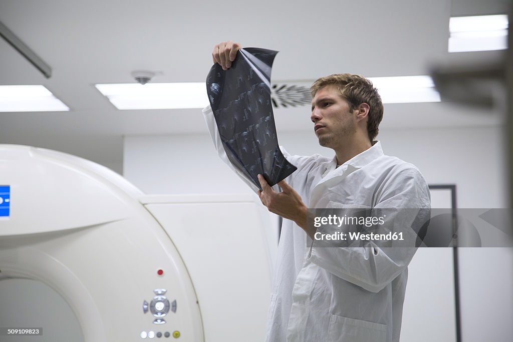 Radiologist looking at radiography in hospital