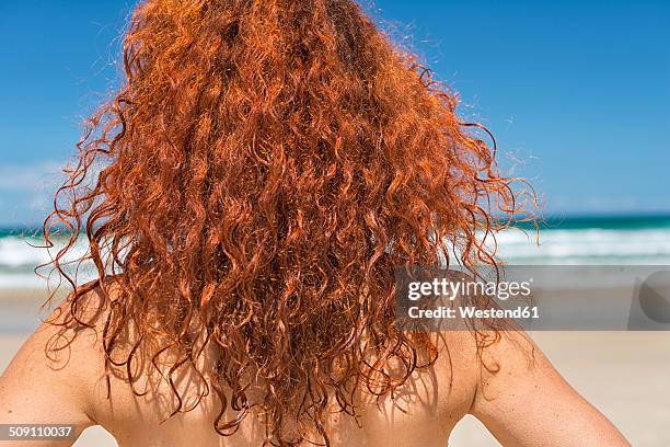 australia, new south wales, broken bay, red-haired woman looking at sea, back view - south australia beach stock pictures, royalty-free photos & images