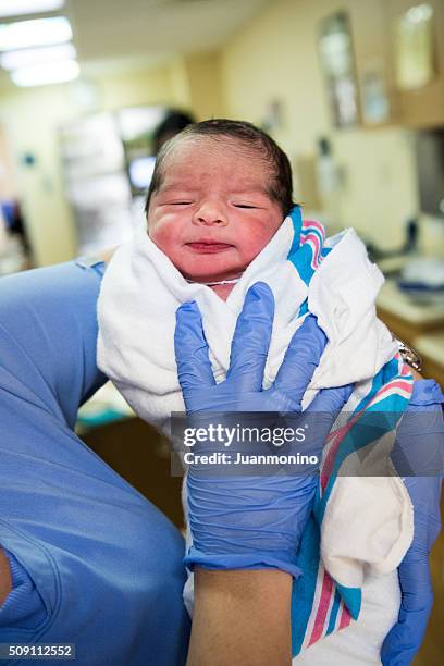 smiling newborn child at the hospital - smirking doctor stock pictures, royalty-free photos & images