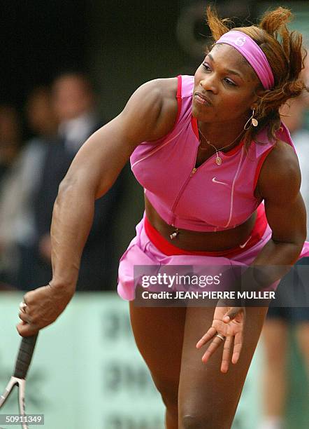 Serena Williams serves to Japanese Shinobu Asagoe in the fourth round of the French Open at Roland Garros in Paris 30 May 2004. AFP PHOTO JEAN-PIERRE...
