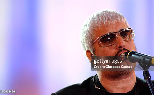 Pino Daniele performs on stage during the first concert of the Festivalbar May 29, 2004 in Milan, Italy. The Festivalbar tours throughout Italy...