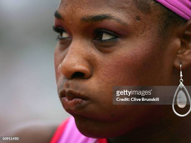 Serena Williams of the USA looks on in her fourth round match against Shinobu Asagoe of Japan during Day Seven of the 2004 French Open Tennis...