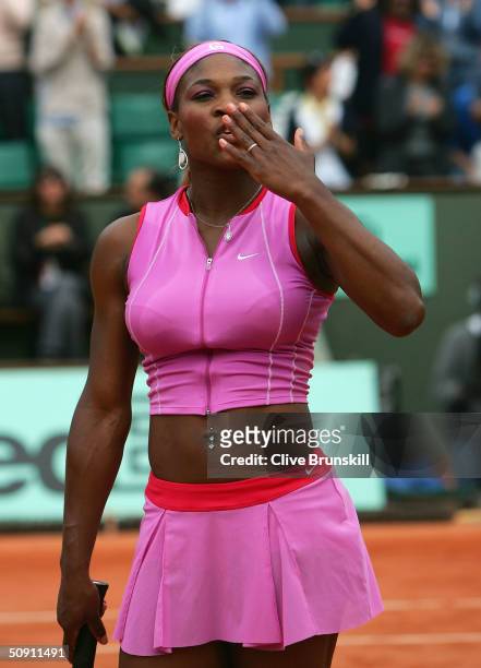 Serena Williams of the USA celebrates after winning her fourth round match against Shinobu Asagoe of Japan during Day Seven of the 2004 French Open...