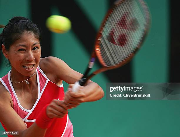 Shinobu Asagoe of Japan returns in her fourth round match against Serena Williams of the USA, during Day Seven of the 2004 French Open Tennis...