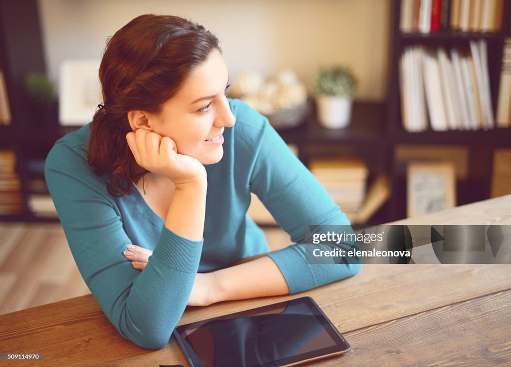 Beautiful young woman working at home