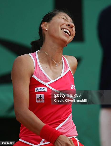 Shinobu Asagoe of Japan reacts during her fourth round match against Serena Williams of the USA during Day Seven of the 2004 French Open Tennis...