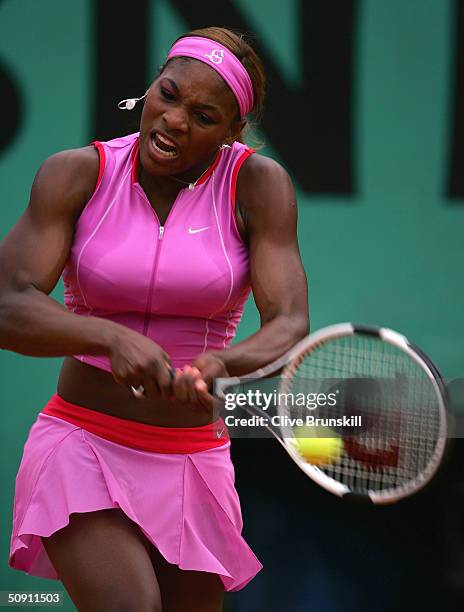 Serena Williams of the USA hits a return in her fourth round match against Shinobu Asagoe of Japan during Day Seven of the 2004 French Open Tennis...