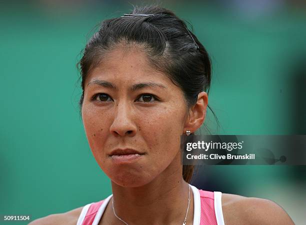 Shinobu Asagoe of Japan looks on in her fourth round match against Serena Williams of the USA during Day Seven of the 2004 French Open Tennis...