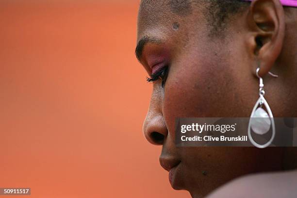 Serena Williams of the USA looks on in her fourth round match against Shinobu Asagoe of Japan during Day Seven of the 2004 French Open Tennis...