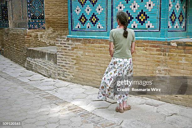 woman admiring tilework - one senior woman only stock pictures, royalty-free photos & images