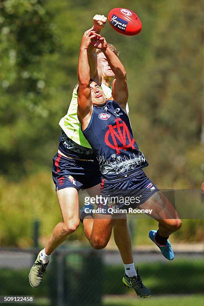 Tom McDonald of the Demons spoils a mark by Ben Kennedy during a Melbourne Demons AFL pre-season training session at Gosch's Paddock on February 9,...