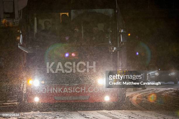 Republican presidential candidate, Ohio Gov. John Kasich arrives on his campaign bus at an election eve rally at Robie's Country Store on February 8,...