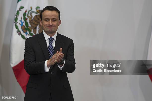 Mikel Andoni Arriola Penalosa, the newly appointed director of the Mexican Social Security Institute , claps after an announcement by Enrique Pena...