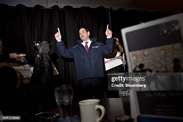 Senator Marco Rubio, a Republican from Florida and 2016 presidential candidate, center, speaks during a campaign stop at the Village Trestle...