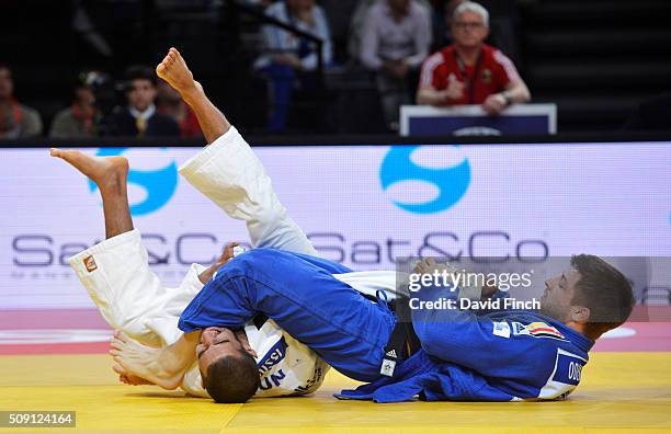 Marc Odenthal of Germany armlocks Oussama Mahmoud Snoussi of Tunisia into submission during their u90kg contest at the Paris Grand Slam, Sunday, 7...